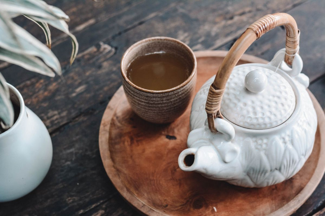 tea cup and tea pot on a platter